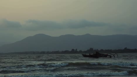 Empty-boats-floating-on-sea-waves-in-late-rain-evening.