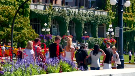 Victoria-City-Flowers-Downtown,-Tourists-and-Empress-Hotel-Facade