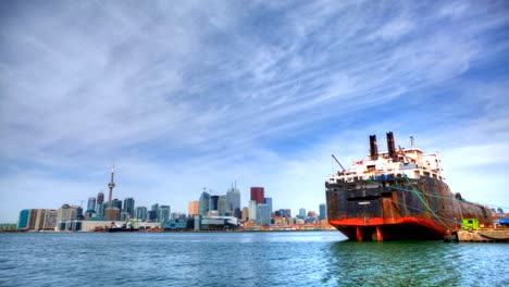 Timelapse-view-of-Toronto-harbor-with-freighter,-Canada