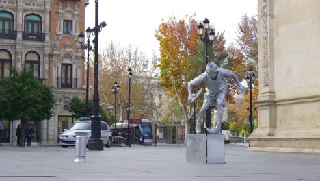 seville-day-light-street-silver-living-statue-4k-spain