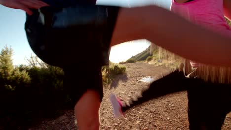 Young-couple-warming-up-before-running-outdoors