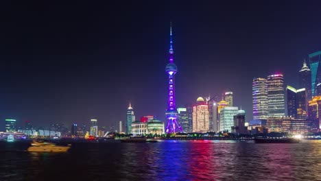 china-night-illumination-famous-shanghai-city-bay-tourist-ship-panorama-4k-time-lapse