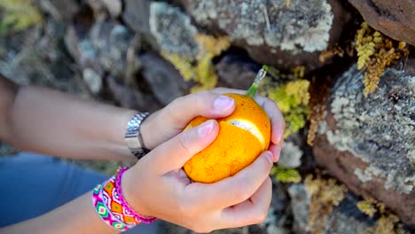 Opening-up-the-Granadilla-fruit