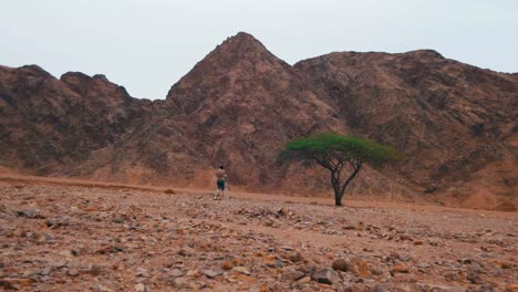 Woman-Videographer-with-Tripod-in-the-Desert-of-Egypt