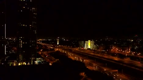 Tel-Aviv,-Israel,-Aerial-View-At-NightTel-Aviv,-Israel,-Aerial-View-of-ayalon-highway,-city-skyline-at-night