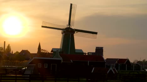 View-of-the-bright-sun-about-to-set-in-the-village-of-Zaanse-Schans