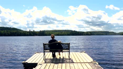 Mother-and-Child-Sitting-by-a-Lake