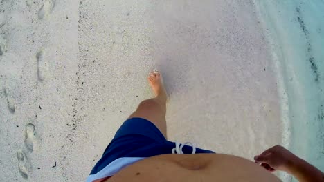 Lost-man-walking-on-sand-with--footsteps-in-sand,-POV-from-above