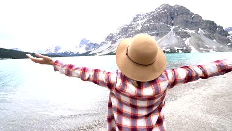 Woman-arms-outstretched-in-nature