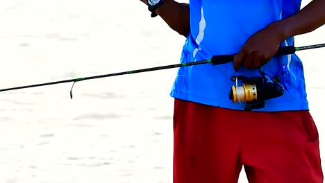 Daily-life-videoClose-up-The-hand-of-the-fishing-is-using-the-fishing-hook-In-the-tropical-Sea-.