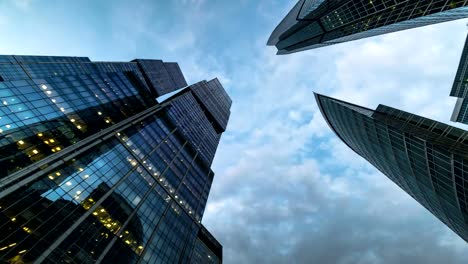 bottom-up-view-of-rotating-skyscrapers-and-flying-clouds,time-lapse,-hyper-lapse