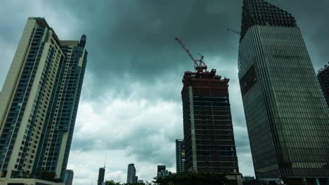 High-rise-building-in-Bangkok-with-rain-clouds-sky.