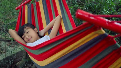 Slow-motion,-Little-girl-is-sleeping-in-hammock