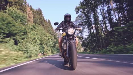 modern-scrambler-motorbike-on-the-forest-road-riding