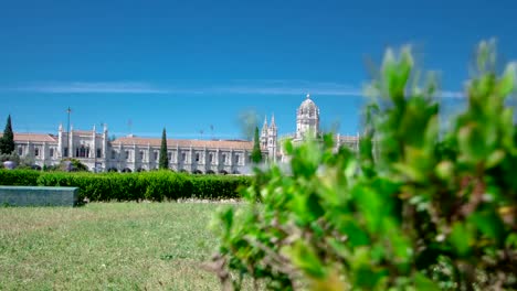 The-Jeronimos-Monastery-or-Hieronymites-Monastery-with-lawn-and-fountain-is-located-in-Lisbon,-Portugal-timelapse-hyperlapse