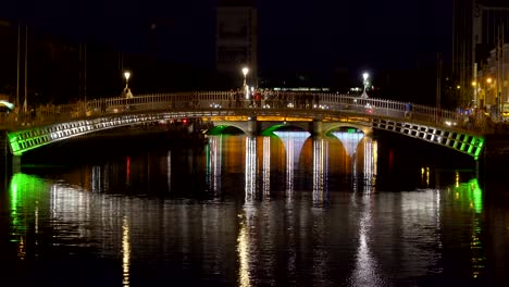 Small-bridge-with-people-passing-by-at-night