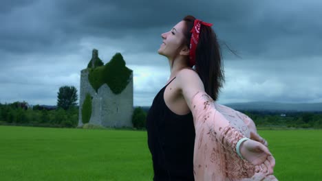 4k-Castle-in-Background-Shot-of-a-Woman-in-wind