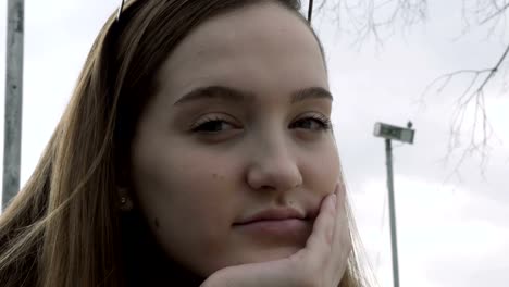 Portrait-of-serious,-pensive-teenage-girl-looking-to-the-camera.