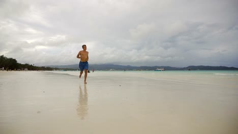 Man-running-on-the-beach