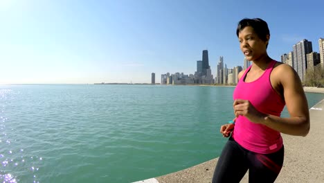 African-American-female-running-along-Chicago-city-shoreline