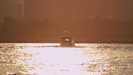 Cabin-cruiser-on-Lake-Michigan-at-sunset-Chicago