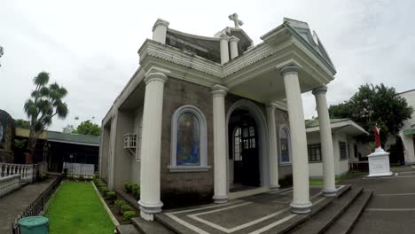 Adoration-chapel-of--Our-Lady-of-Pillar-of-Alaminos,-Laguna,-Philippines-showing-her-facade.-Underside-view,-rotating-tracking-shot