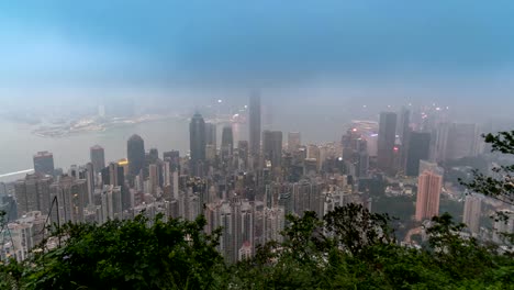 Hong-Kong-time-lapse-4K,-city-skyline-day-to-night-timelapse-view-from-Victoria-Peak-with-mist