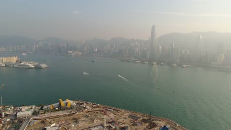 China-puesta-del-sol-famosa-hong-kong-Bahía-de-construcción-aérea-panorama-4k