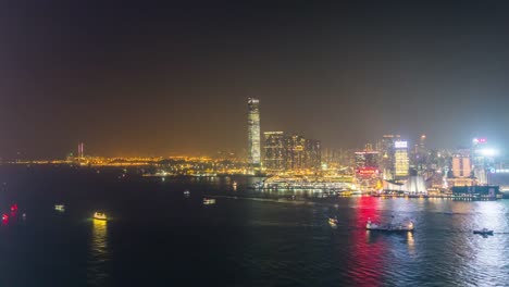 China-Hong-Kong-Stadt-berühmte-Nacht-Leuchtturm-Kowloon-Bay-auf-dem-Dach-Panorama-4k-Zeitraffer