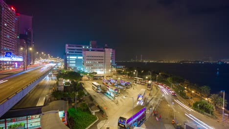 China-noche-iluminación-hong-kong-ciudad-autobús-estación-en-la-azotea-panorama-4k-lapso-de-tiempo