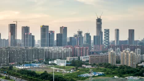 Lapso-de-tiempo-del-paisaje-urbano-en-la-ciudad-nueva-de-Hexi,-puesta-de-sol,-ciudad-de-nanjing,-china