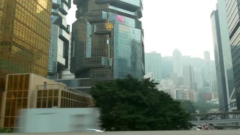 día-tiempo-hong-kong-ciudad-centro-taxi-carretera-viaje-lateral-vista-a-la-calle-panorama-4k-china