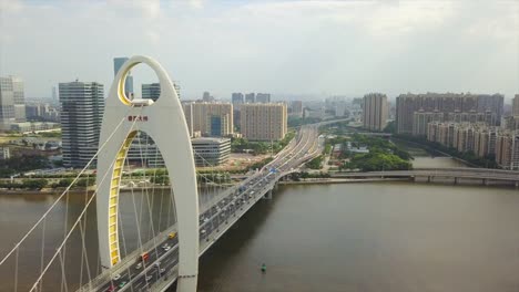 día-soleado-guangzhou-ciudad-tráfico-liede-Puente-Río-Perla-china-de-panorama-aéreo-4k