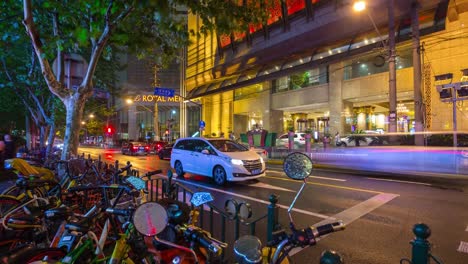 night-shanghai-city-traffic-street-bicycle-parking-panorama-4k-timelapse-china