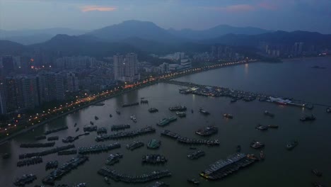 Puerto-de-paisaje-urbano-de-zhuhai-Bahía-noche-tiempo-estacionamiento-china-panorama-aéreo-4k