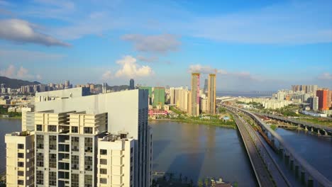tráfico-de-paisaje-urbano-de-zhuhai-día-soleado-puente-Macao-ciudad-Bahía-panorama-aéreo-4k-china