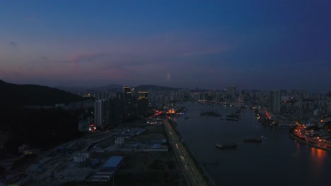 puesta-de-sol-de-la-noche-tiempo-zhuhai-ciudad-río-Bahía-panorama-aéreo-4k-china