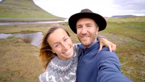 4K-Selfie-portrait-of-tourist-couple-in-Iceland-at-Kirkjufell-mountain