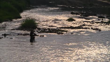 A-man-fly-fishing-in-a-river