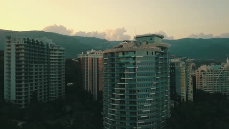 new-modern-apartment-building-skyscrapers-in-the-mountain-city-aerial-panorama-view