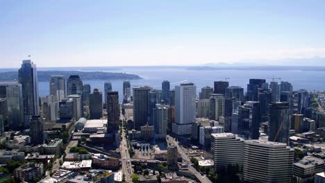 Downtown-Seattle-Waterfront-Buildings-Blue-Sky-Aerial