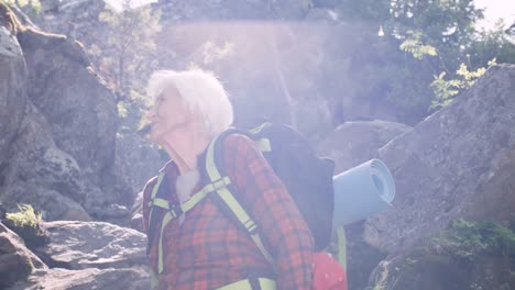 Senior-Female-Hiker-Resting-in-Mountains