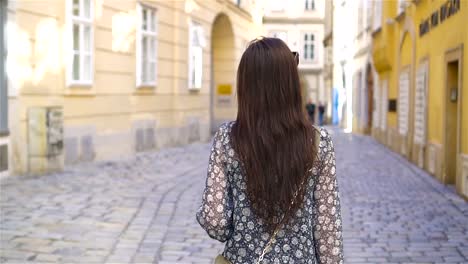 Woman-walking-in-city.-Young-attractive-tourist-outdoors-in-italian-city