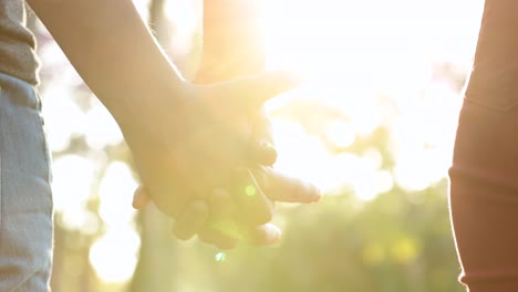 Joining-hands-together,-uniting-the-chain-from-hands-held-together-in-the-sunlight