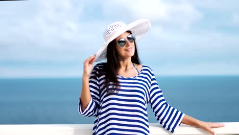 Pretty-woman-in-sunglasses-smiling-having-good-time-outdoor-standing-near-antique-railing