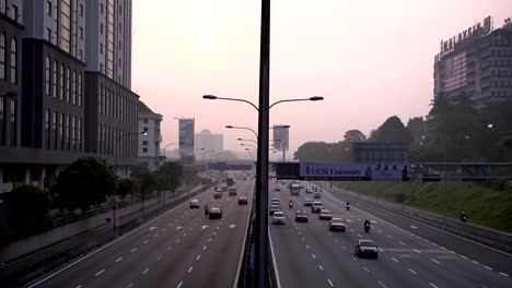 Kuala-Lumpur,-Malaysia---September-19,-2015:-4k-footage-of-road-at-Kuala-Lumpur-at-morning-sunrise.