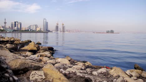 Embankment-of-Baku,-Azerbaijan.-The-Caspian-Sea,-Stones-and-Skyscrapers