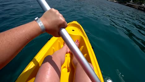 Woman-riding-canoe-in-sea