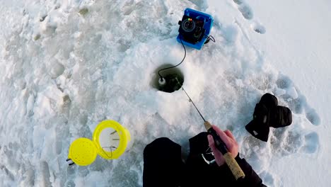 Fisherman-fishing-in-snow