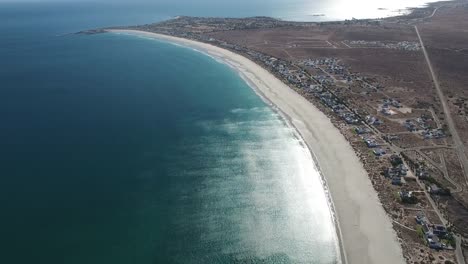 Aerial-View-of-Beautiful-Bay-Coast-with-Coastal-Town